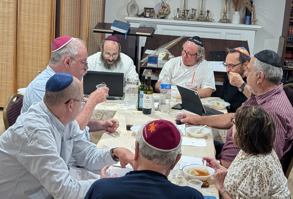 Community members learning together around the table at Soup and Study